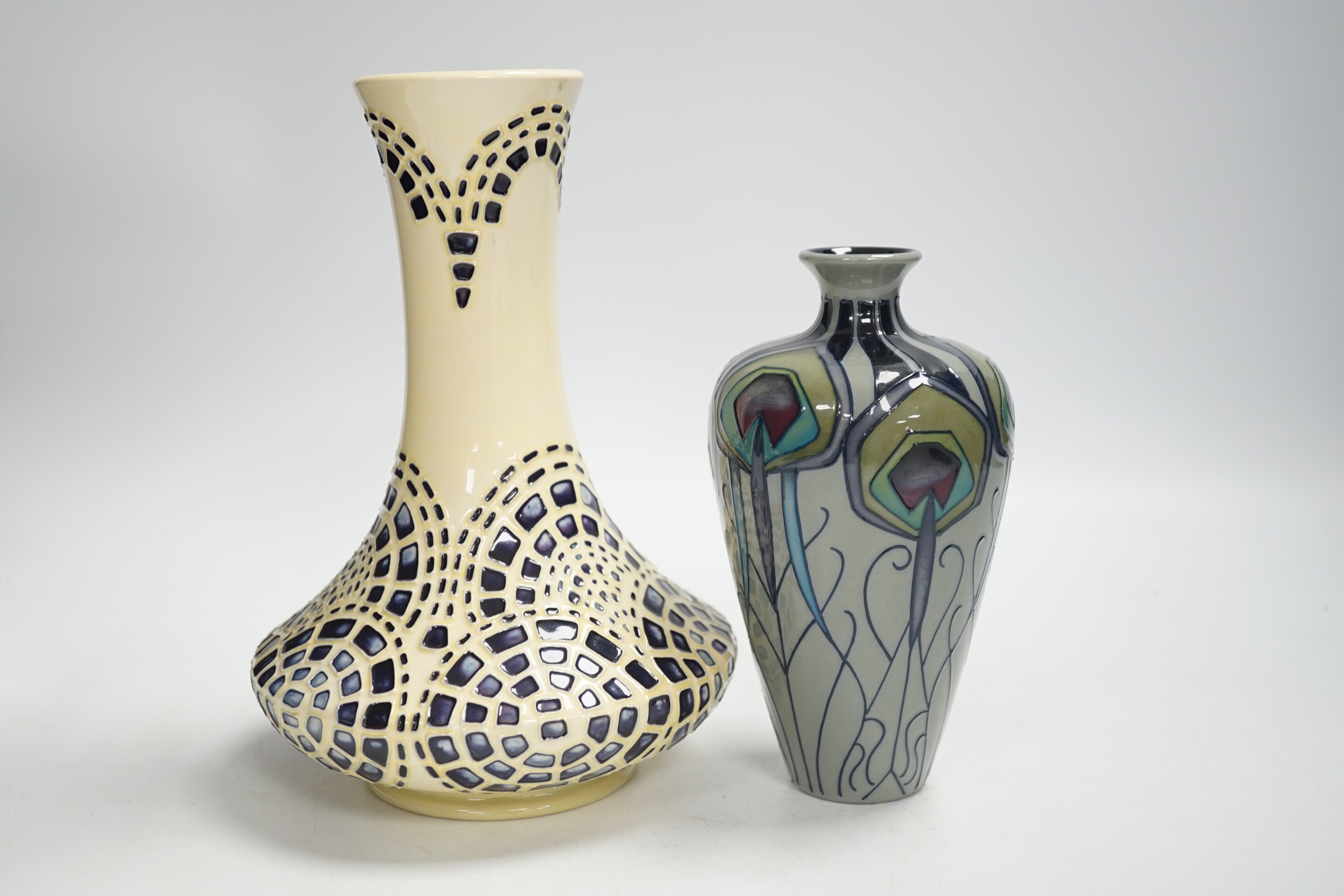 A Moorcroft ‘Peacock Parade’ vase and a Moorcroft secessionist style vase, largest 21cm high